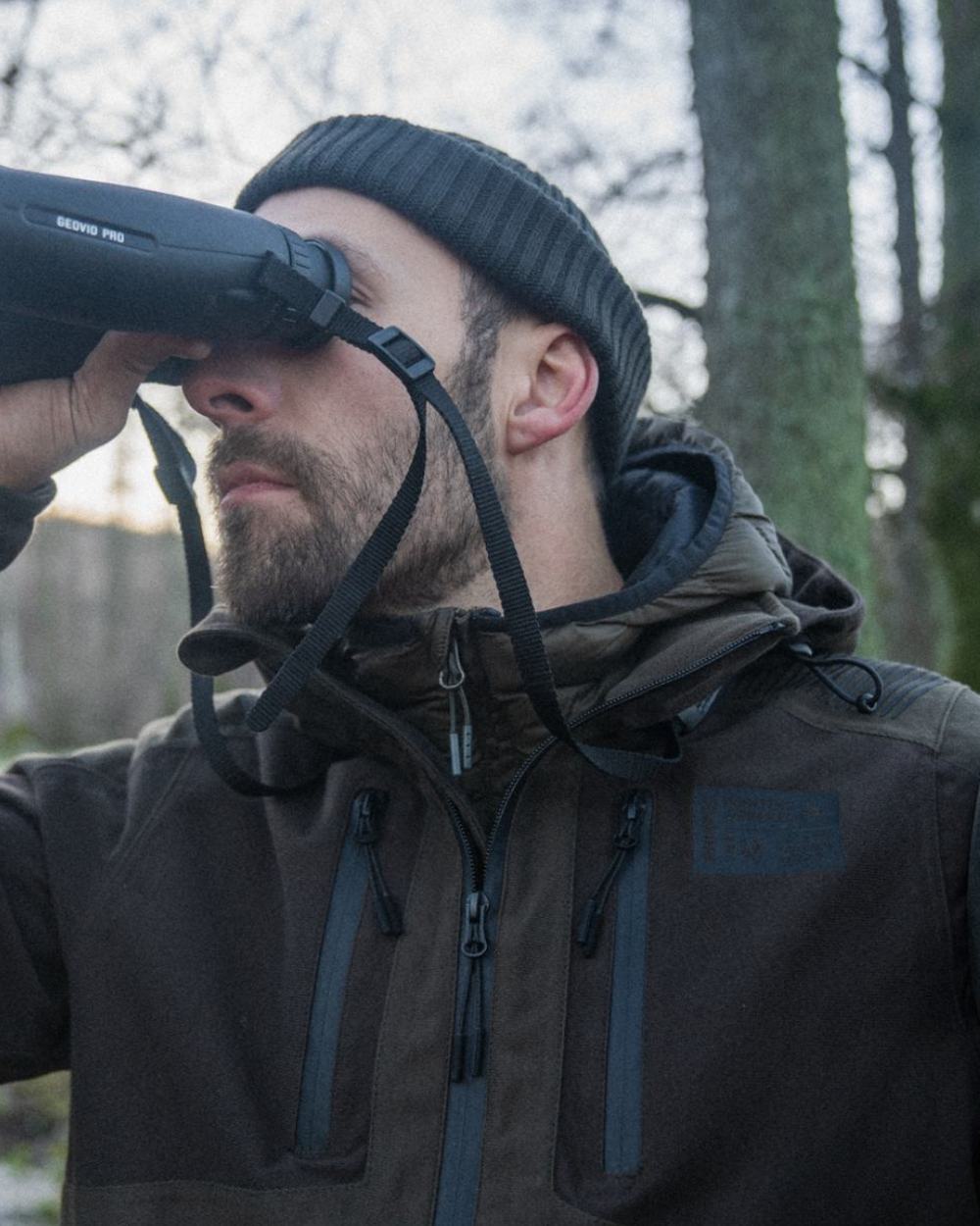 Pine Green Coloured Seeland Chaser Jacket on forest background 