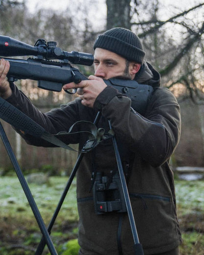 Pine Green Coloured Seeland Chaser Jacket on forest background 