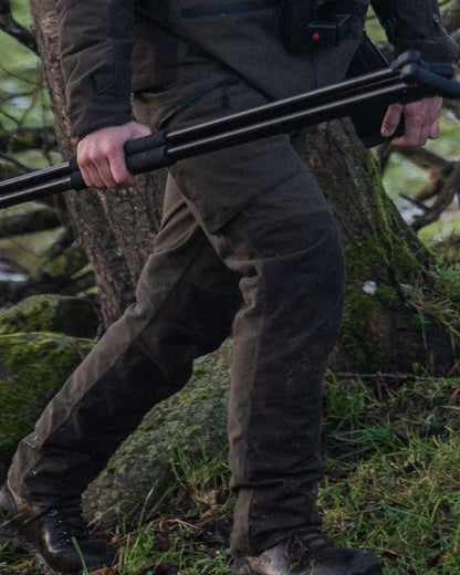 Pine Green Coloured Seeland Chaser Trousers on forest background 