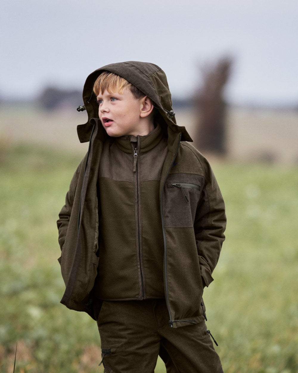 Pine Green Melange Coloured Seeland Childrens Avail Jacket on outdoor background 