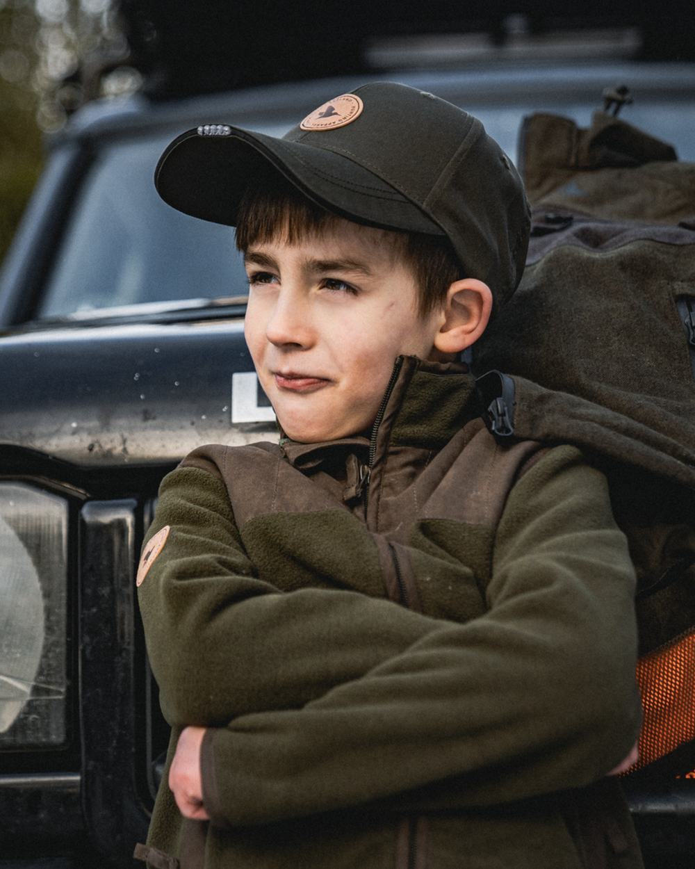 Pine Green Coloured Seeland Childrens Bolt Fleece Jacket on outdoor background 