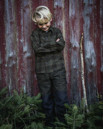 Pine Green Dark Navy Check Coloured Seeland Childrens Glen Flannel Shirt on outdoor background 
