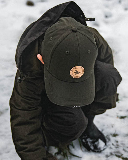 Pine Green coloured Seeland Childrens Skarn LED Junior Cap on forest background 