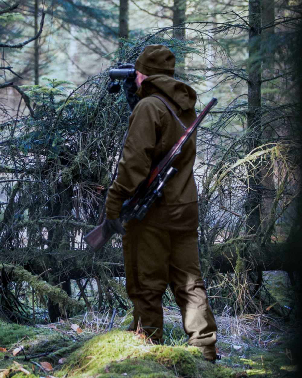 Pine Green Coloured Seeland Climate Hybrid Jacket on outdoor background 