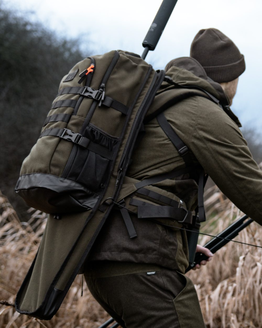 Pine Green coloured Seeland Enduro Backpack on forest background 