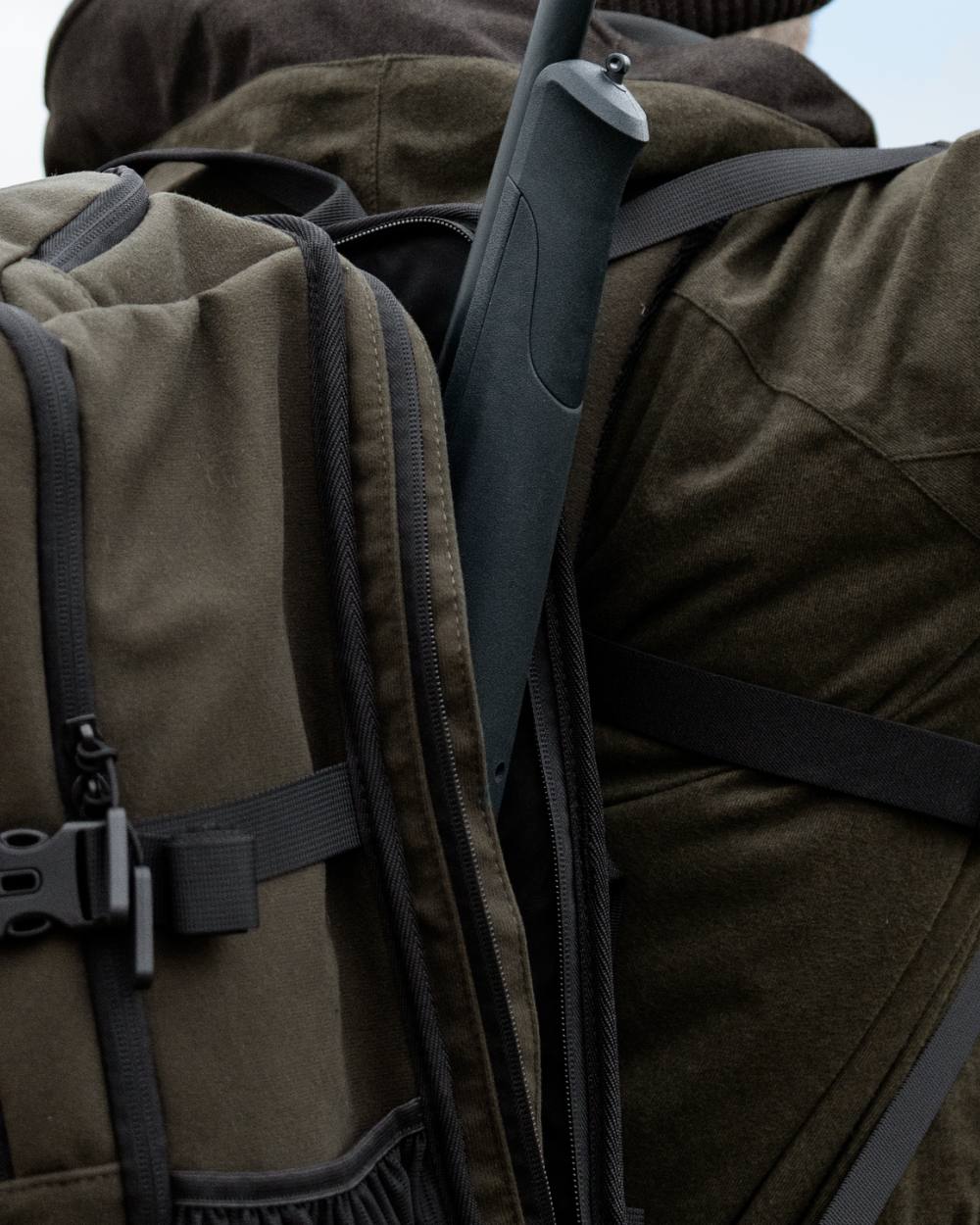Pine Green coloured Seeland Enduro Backpack on forest background 