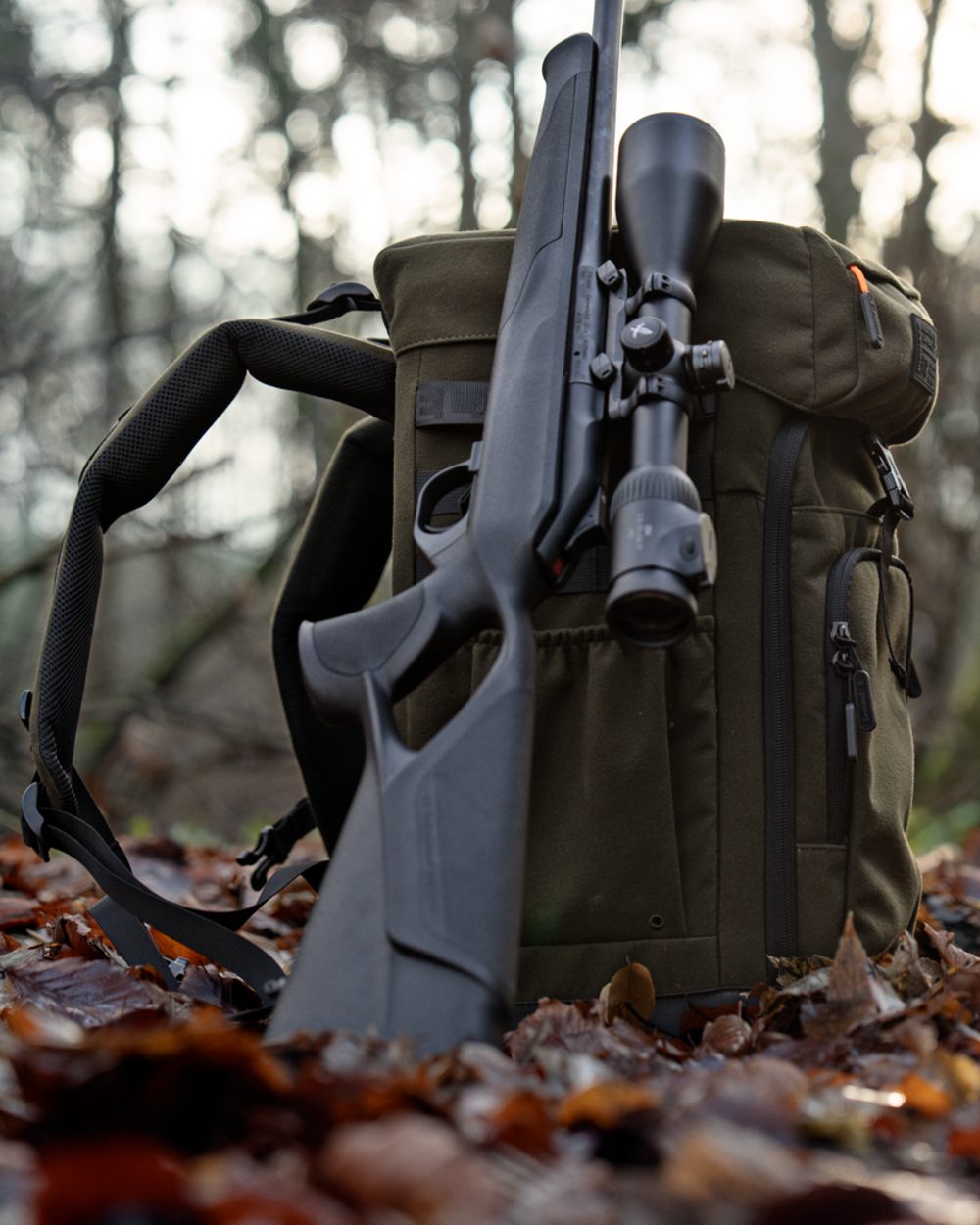 Pine Green coloured Seeland Enduro Chair Backpack on forest background 