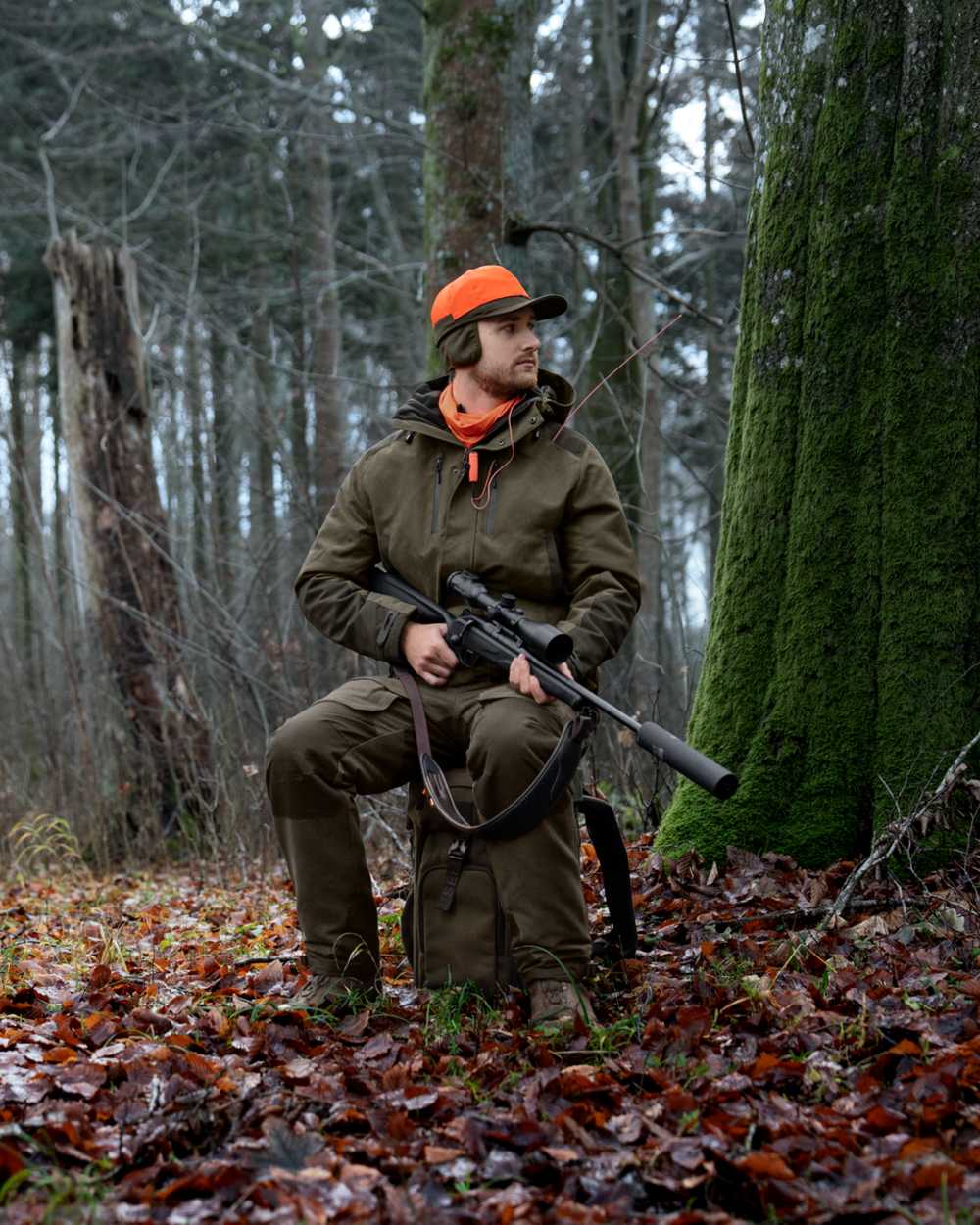 Pine Green coloured Seeland Enduro Chair Backpack on forest background 