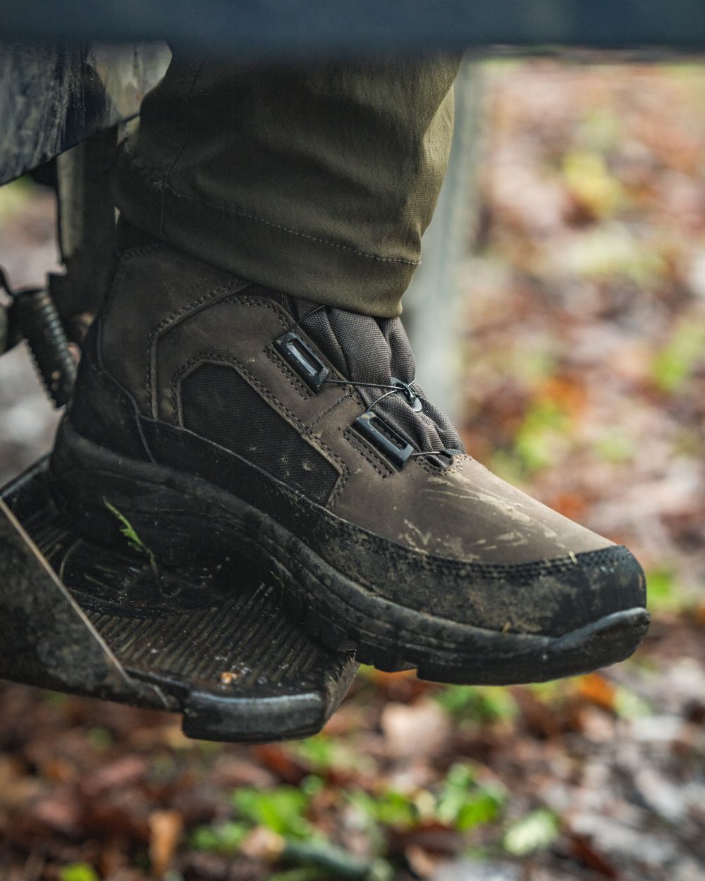 Dark Brown coloured Seeland Enduro Dial Mid Boots on forest background 