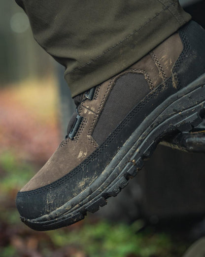Dark Brown coloured Seeland Enduro Dial Mid Boots on forest background 