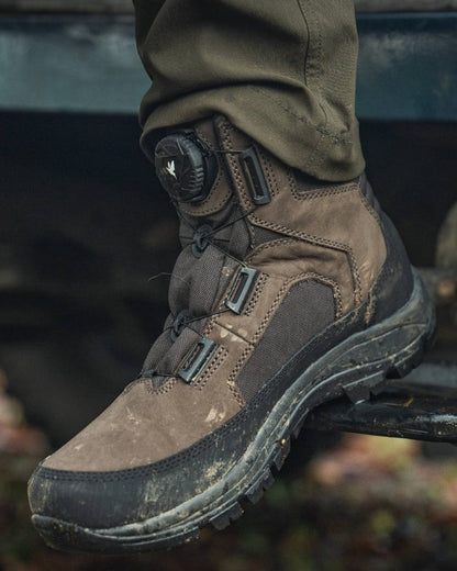 Dark Brown coloured Seeland Enduro Dial Mid Boots on forest background 