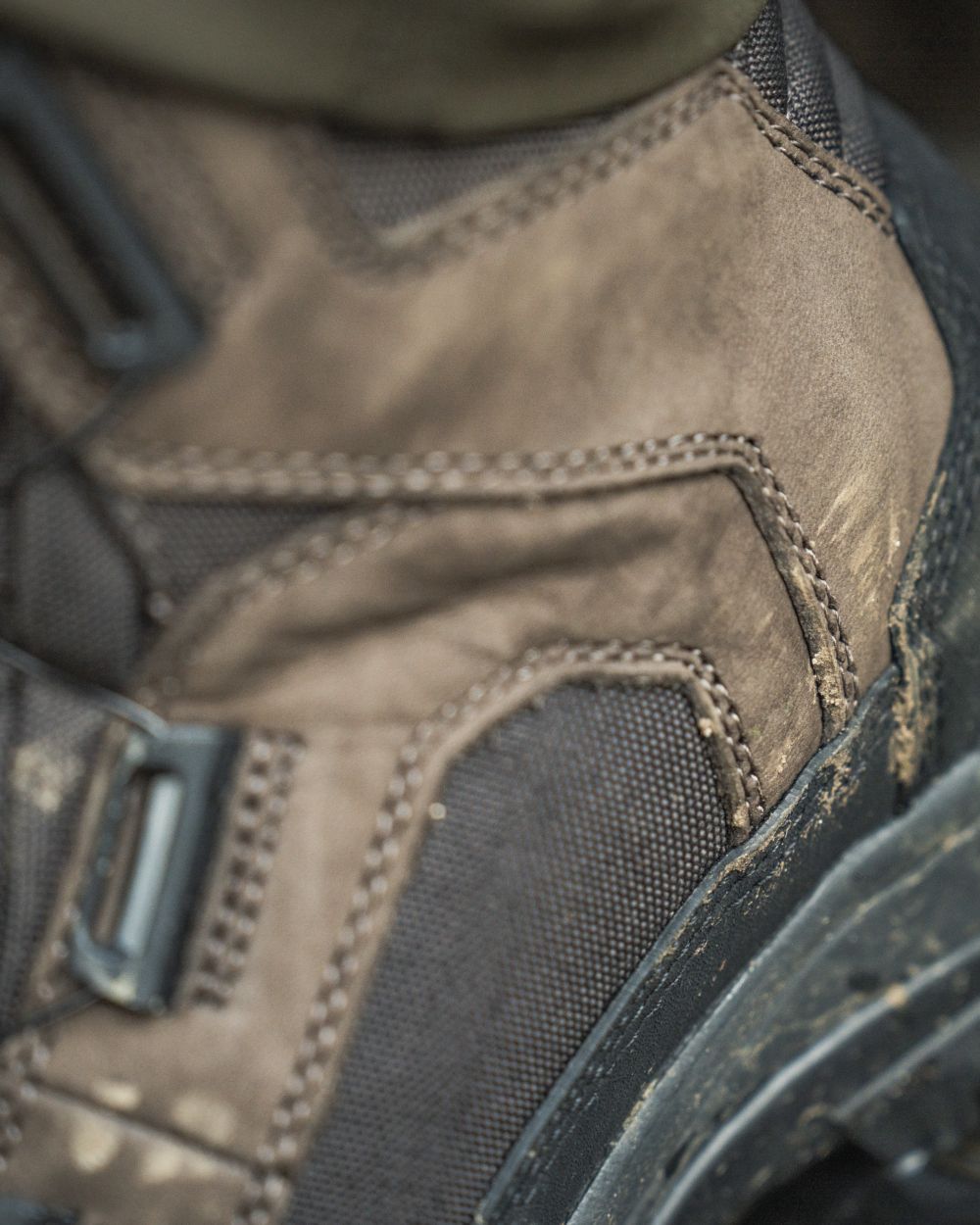 Dark Brown coloured Seeland Enduro Dial Mid Boots on forest background 