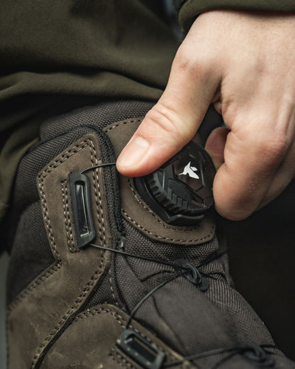 Dark Brown coloured Seeland Enduro Dial Mid Boots on forest background 