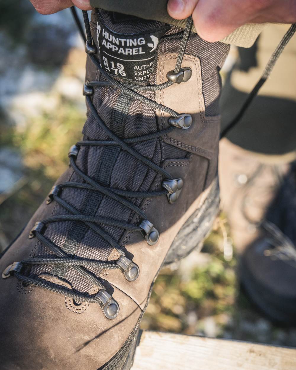 Dark Brown coloured Seeland Enduro Explore Mid Boots on forest background 