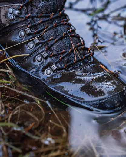 Dark Brown coloured Seeland Enduro Tracker High Boots on forest background 