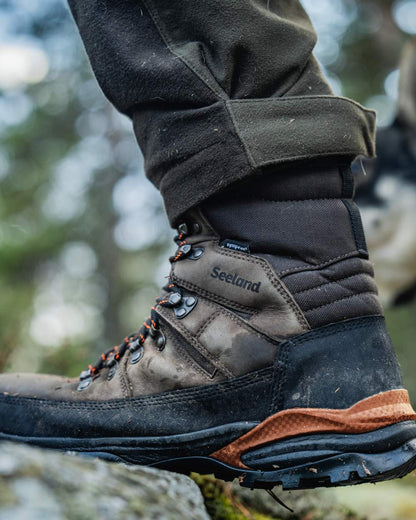 Dark Brown coloured Seeland Enduro Tracker High Boots on forest background 