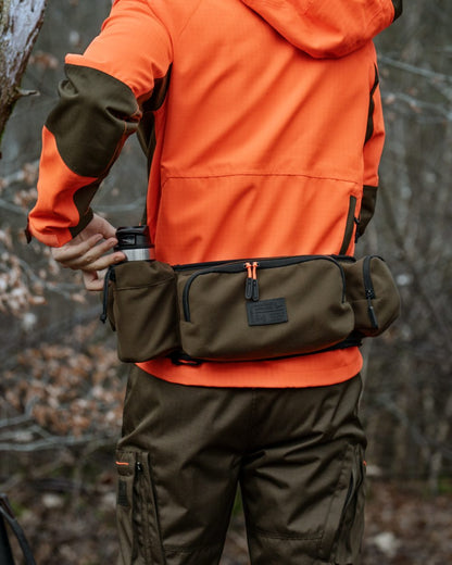 Pine Green coloured Seeland Enduro Utility Waist Pack on forest background 