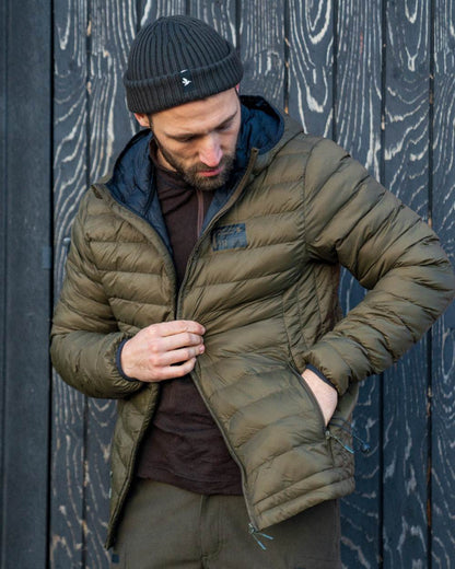 Military Olive coloured Seeland Fahrenheit Jacket on wood background 