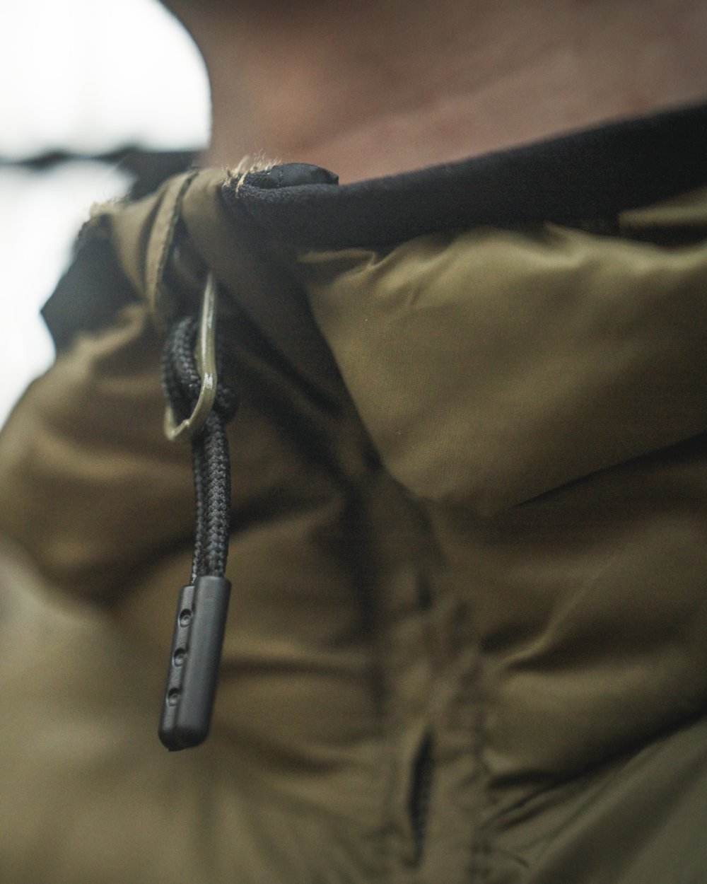 Military Olive coloured Seeland Fahrenheit Jacket on blurry background 