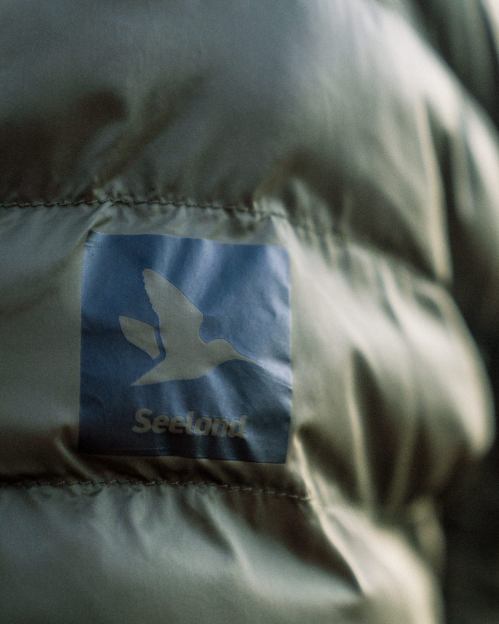 Military Olive coloured Seeland Fahrenheit Jacket on white background 