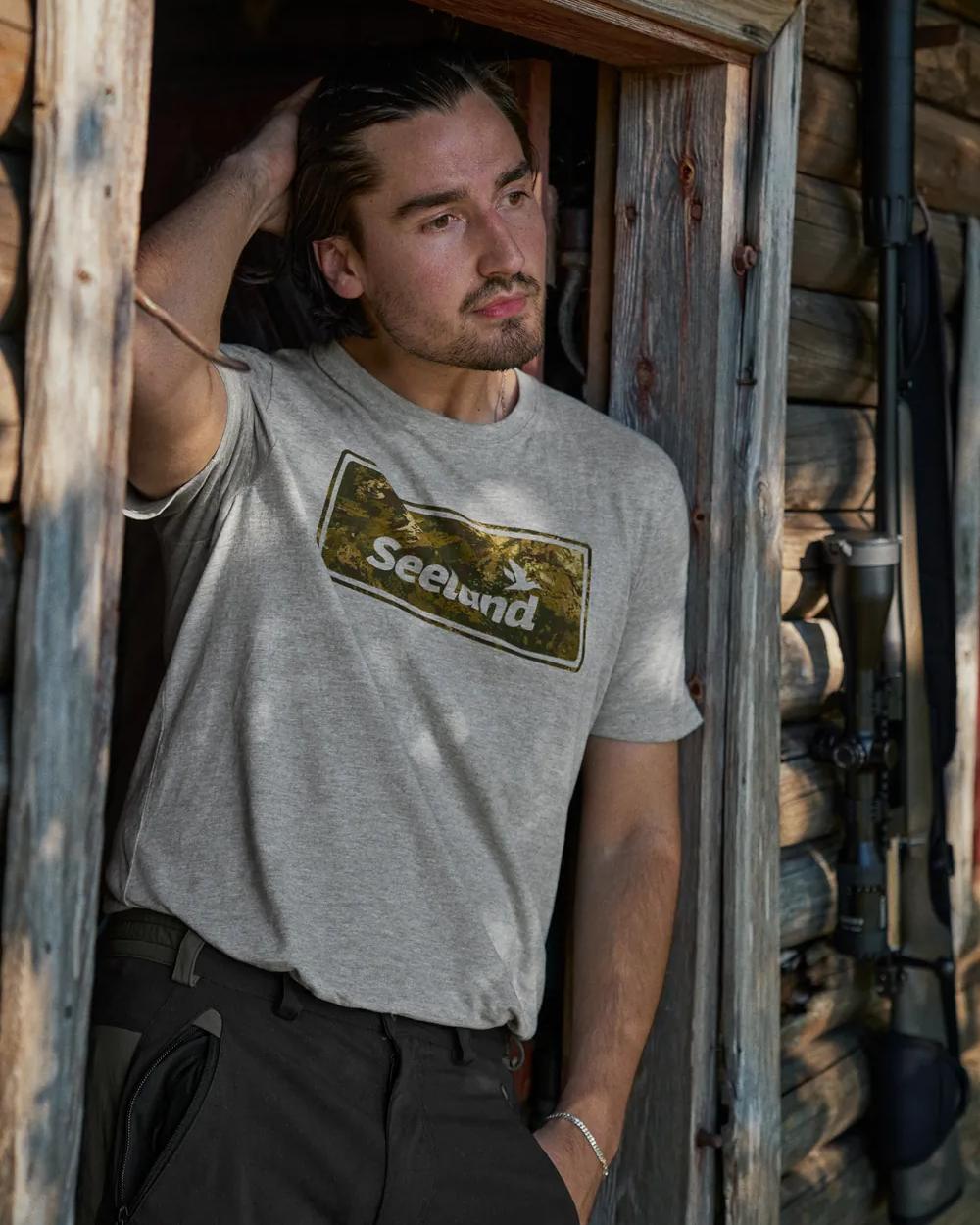 Dark Grey Melange Coloured Seeland Falcon T-Shirt on house background 