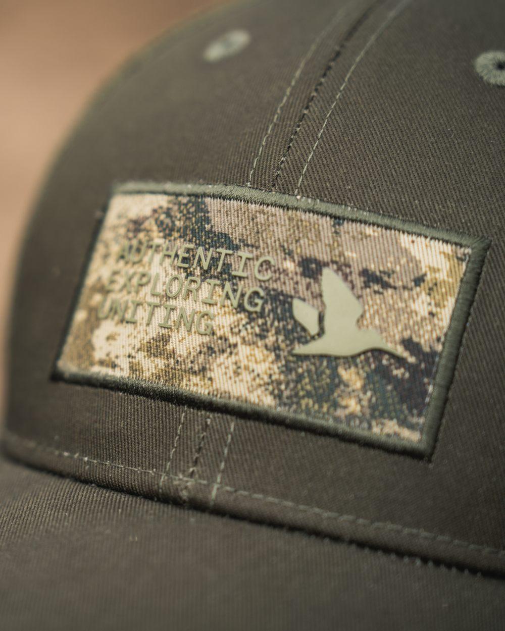 Pine Green Coloured Seeland Ganister Trucker Cap on outdoor background 