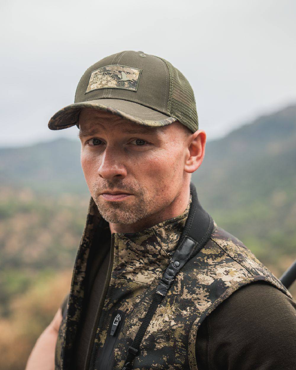 Pine Green Coloured Seeland Ganister Trucker Cap on outdoor background 