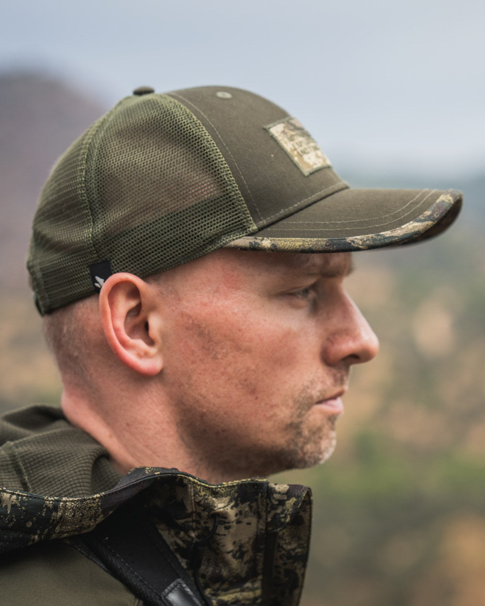 Pine Green Coloured Seeland Ganister Trucker Cap on outdoor background 