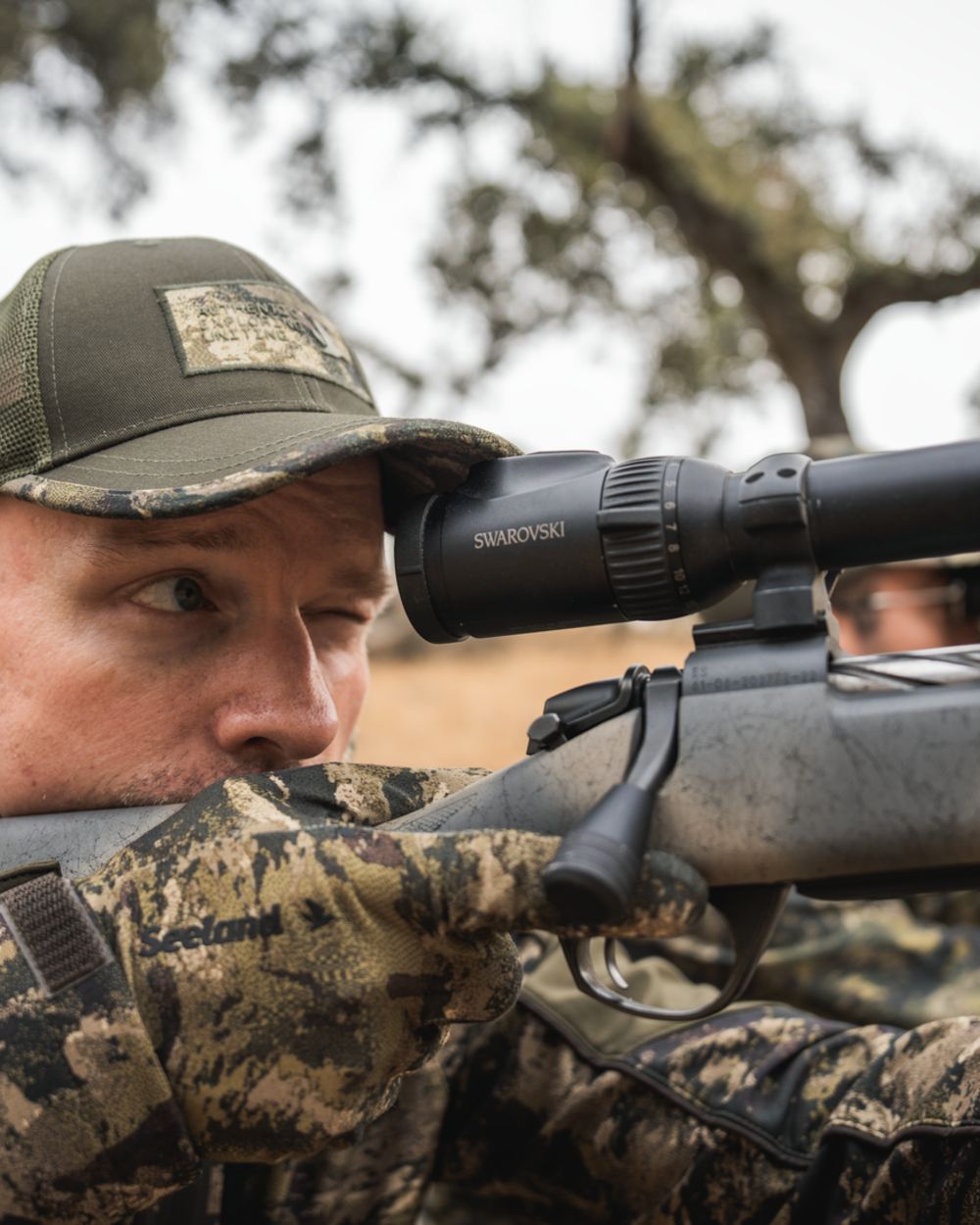 InVis MPC Green coloured Seeland Grip Camo Gloves on forest background 