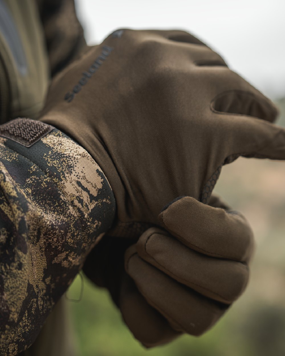 Pine Green Coloured Seeland Grip Gloves on outdoor background 