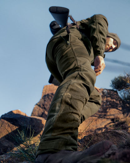 Pine Green Coloured Seeland Hawker Shell II Waterproof Trousers on outdoor background 