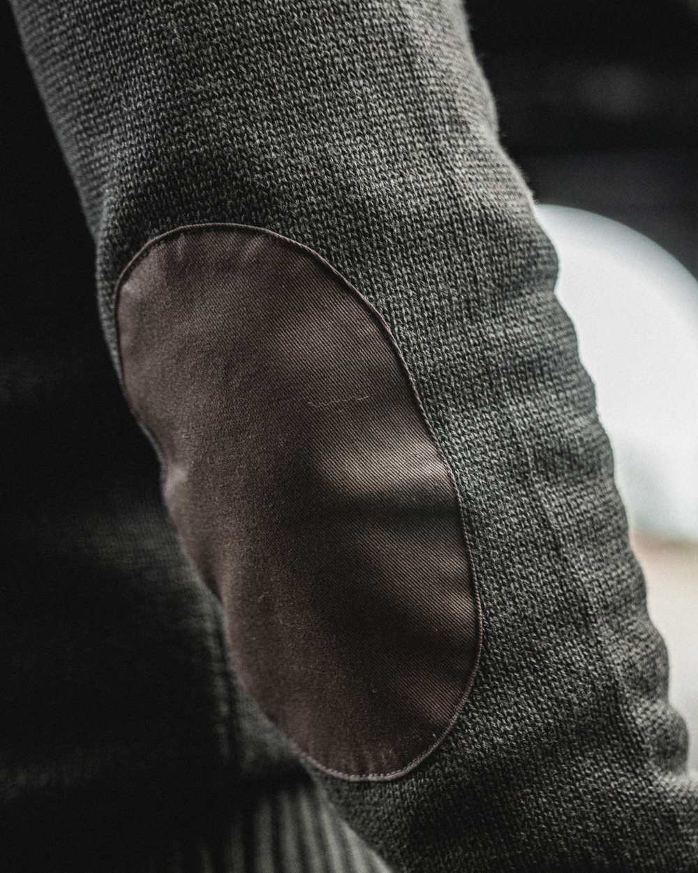 Dark Brown Coloured Seeland Haze Windbreaker Knit On A blurry Background 