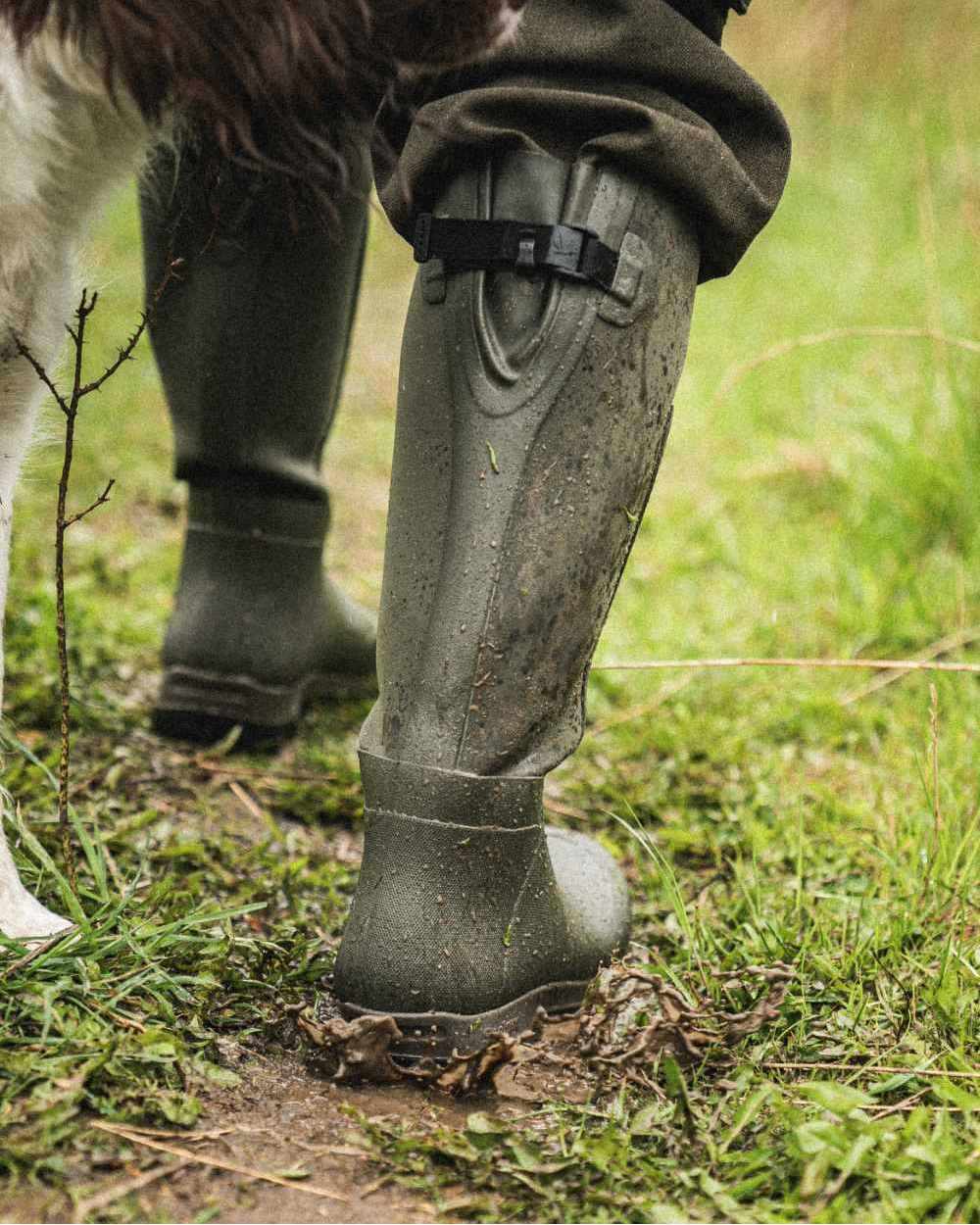 Pine Green Coloured Seeland Hillside Flex Wellingtons on outdoor background 