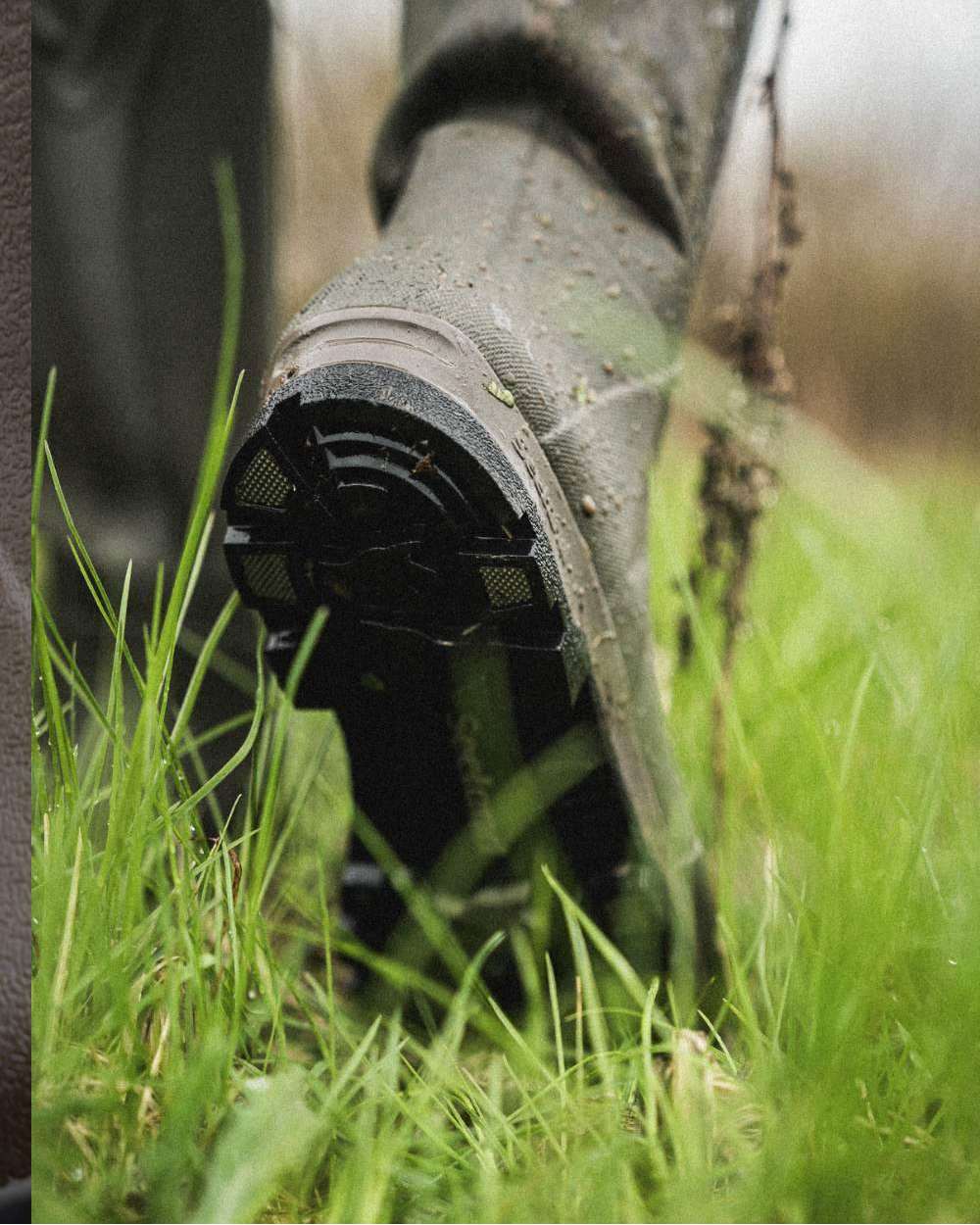 Pine Green Coloured Seeland Hillside Flex Wellingtons on outdoor background 