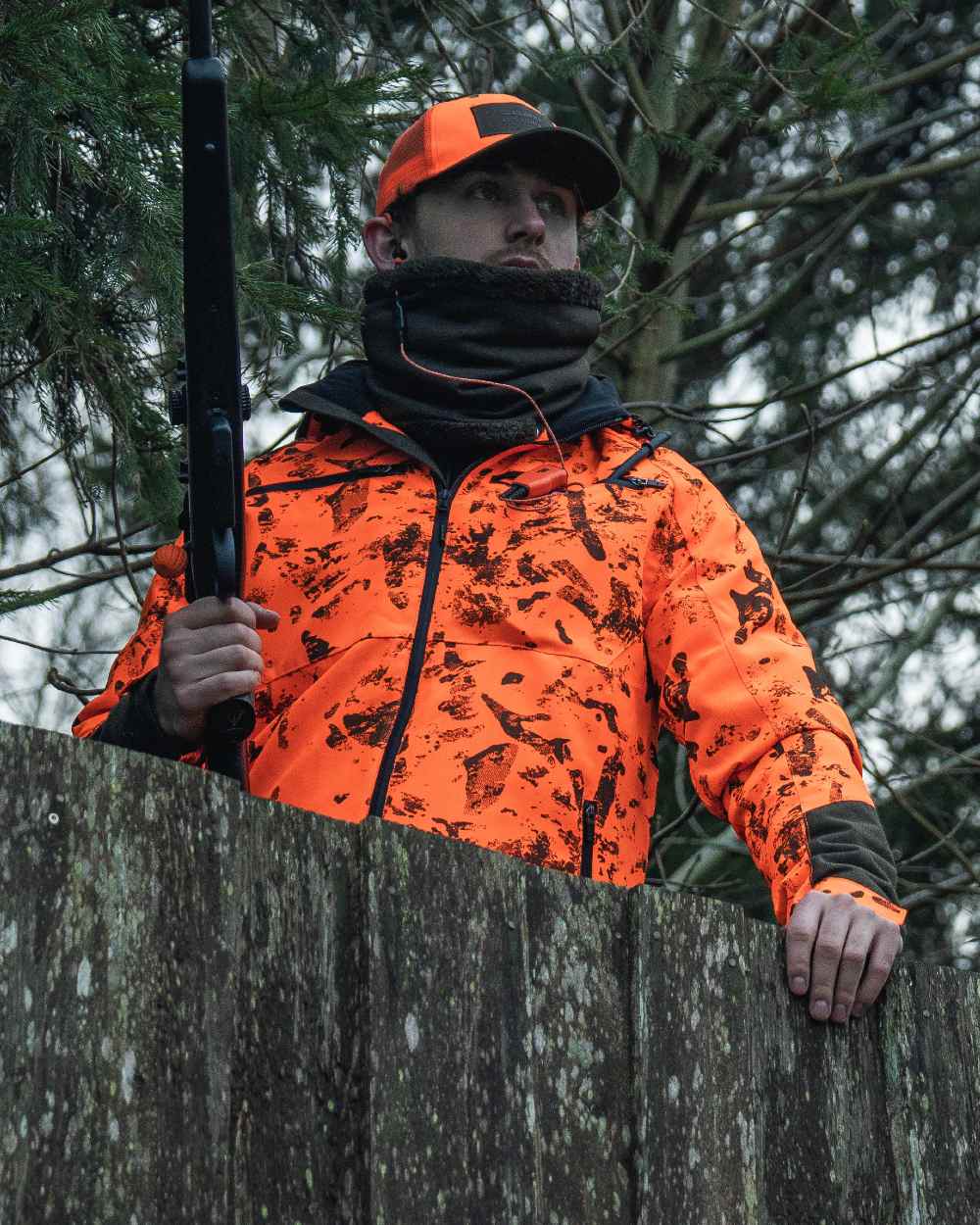 Pine Green coloured Seeland Iron Neckgaiter on forest background 