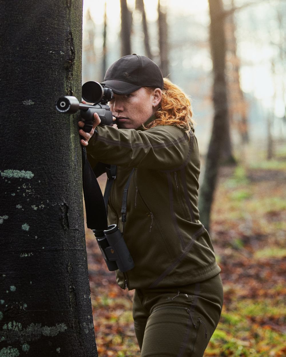 Pine Green coloured Seeland Ladies Hawker Advance Jacket on forest background 