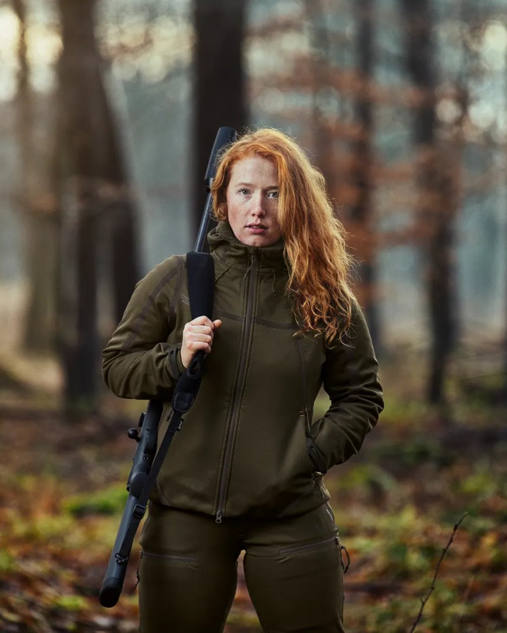 Pine Green coloured Seeland Ladies Hawker Advance Jacket on forest background 