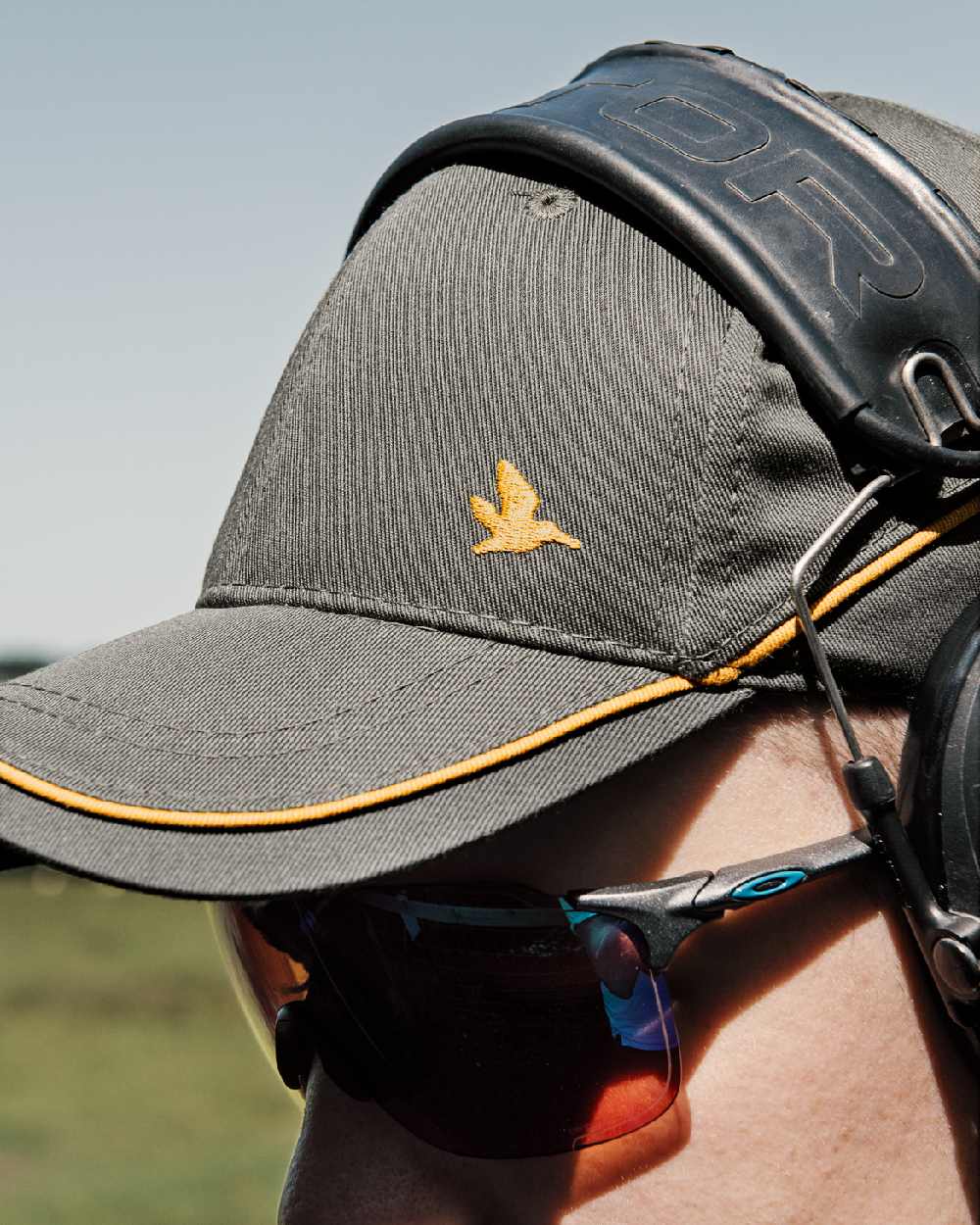 Gunmeta Coloured Seeland Mens Skeet Cap on outdoor background 