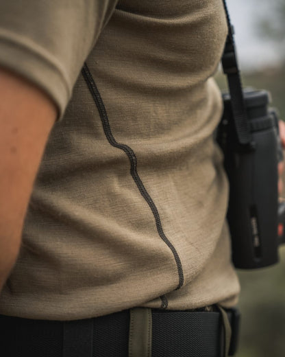 Covert Green Coloured Seeland Mens Apex Merino T-Shirt on mountain background 