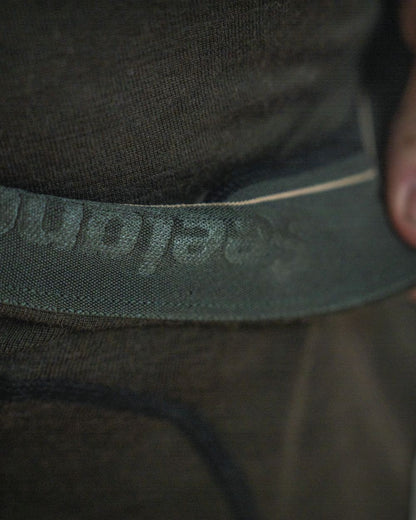 Pine Green Coloured Seeland Mens Apex One Hundred Long Johns on outdoor background 