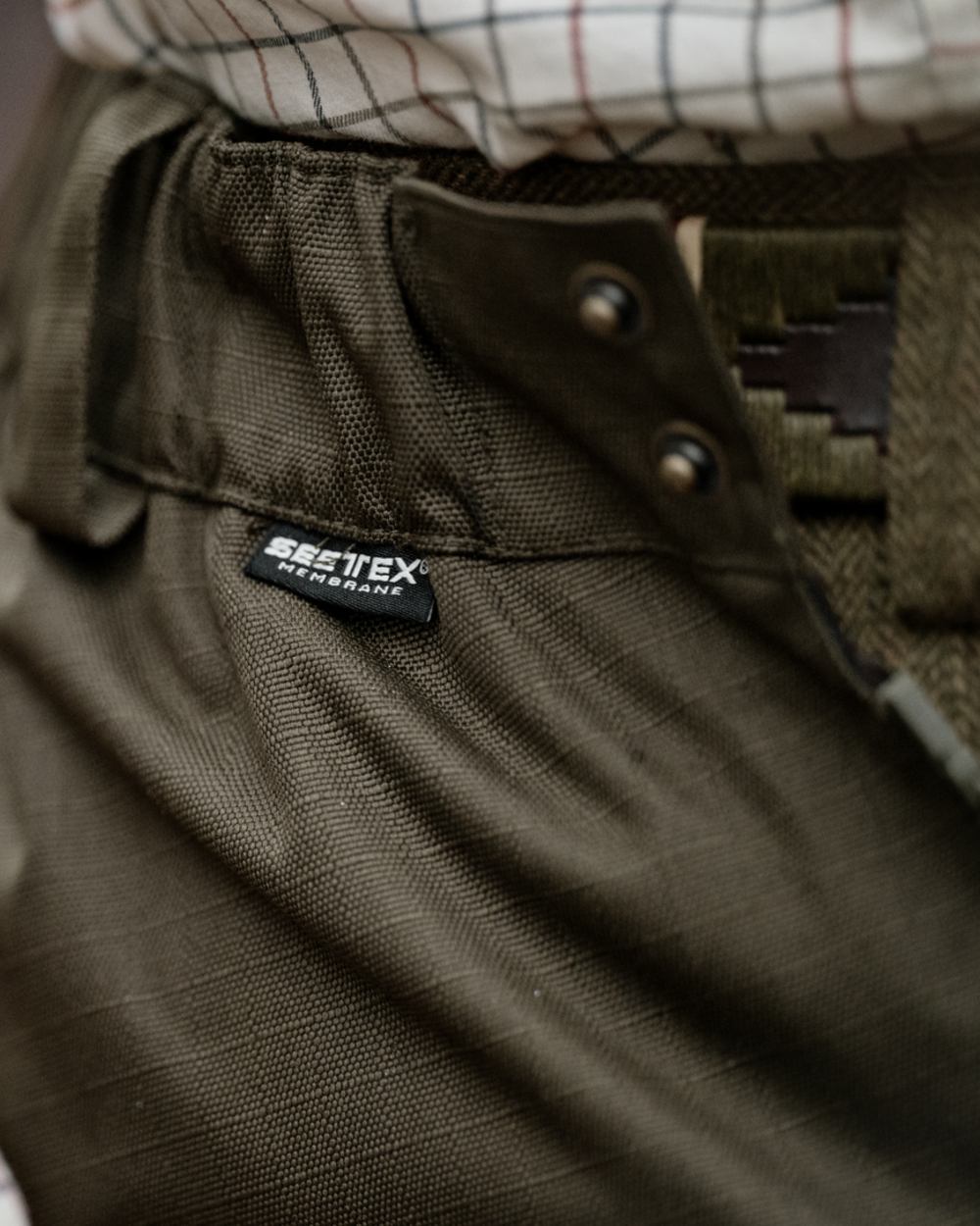 Shaded Olive coloured Seeland Mens Buckthorn Duro Overtrousers on forest background 
