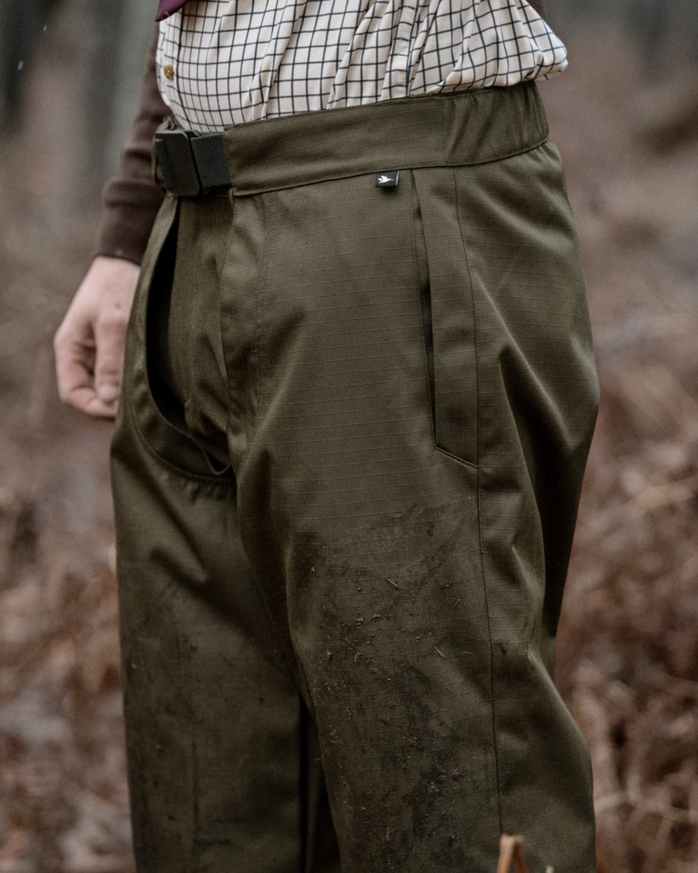 Shaded Olive coloured Seeland Mens Buckthorn Duro Treggings on forest background 