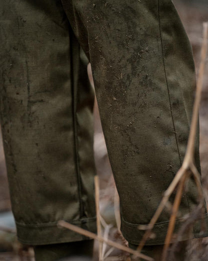 Shaded Olive coloured Seeland Mens Buckthorn Duro Treggings on forest background 