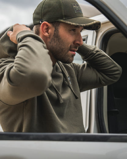 Grape Leaf Coloured Seeland Delta Hoodie on Blurry Background
