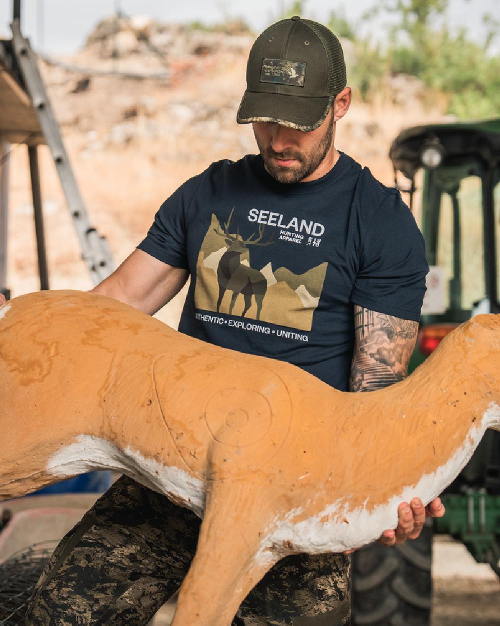 Dark Blue Coloured Seeland Mens Fragment T-Shirt on workshop background 