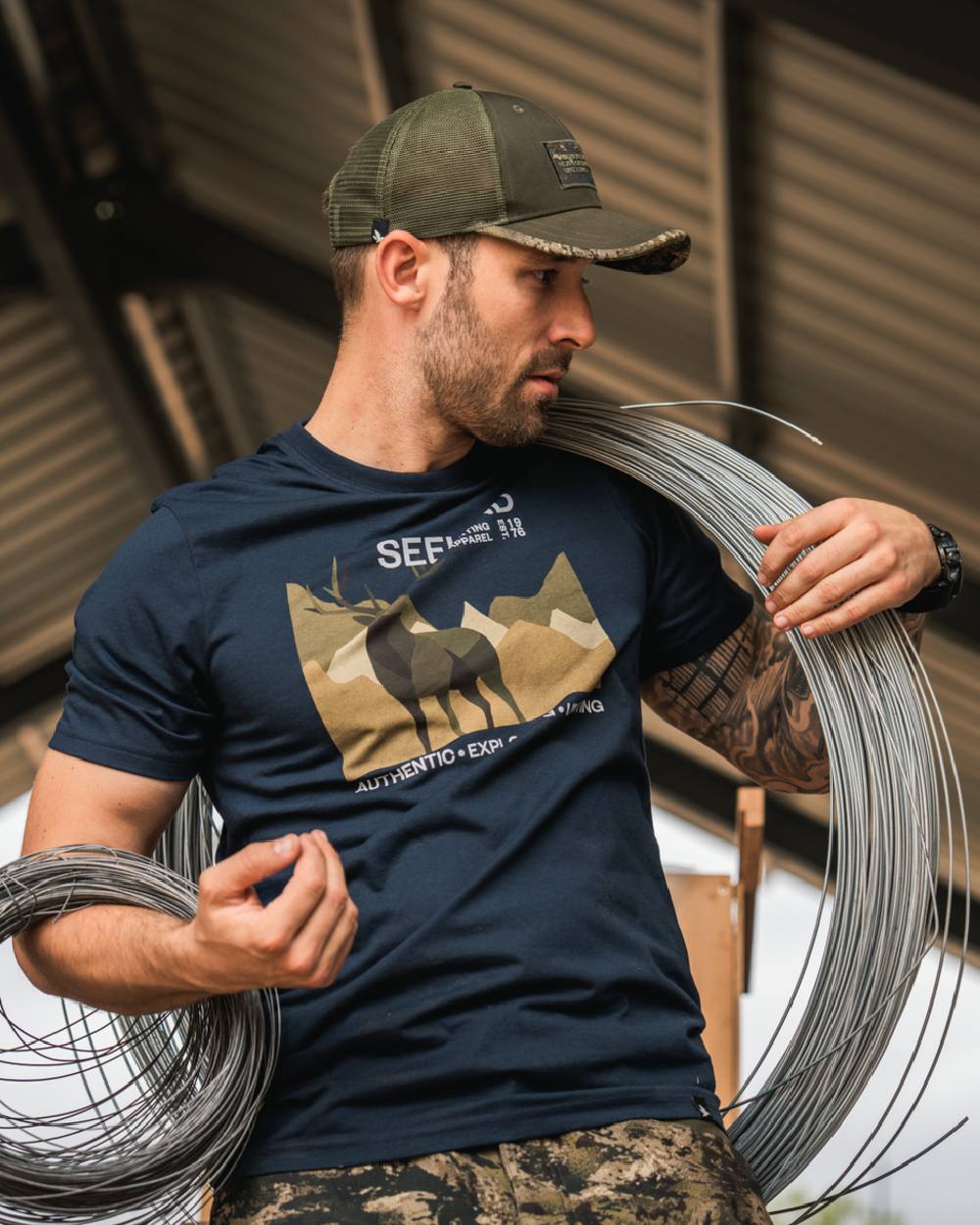 Dark Blue Coloured Seeland Mens Fragment T-Shirt on workshop background 