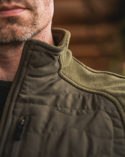 Pine Green Coloured Seeland Mens Gale Fleece Waistcoat on outdoor background 