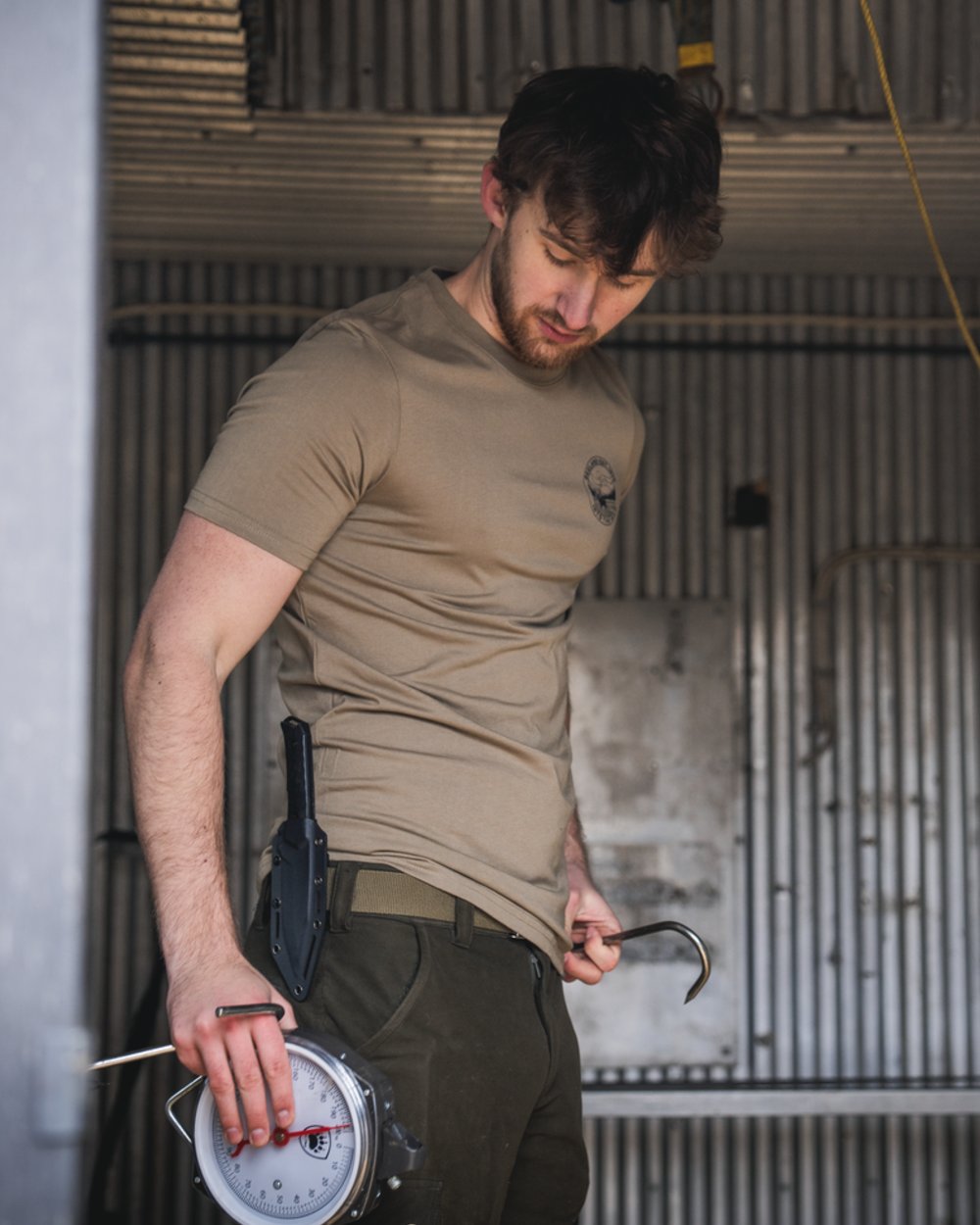 Covert Green coloured Seeland Mens Hunting Landscape T-Shirt on factory background 