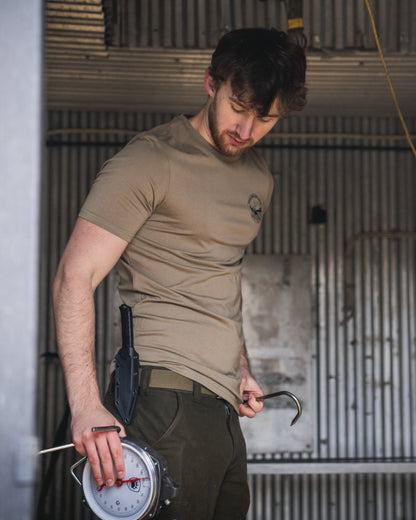 Covert Green coloured Seeland Mens Hunting Landscape T-Shirt on factory background 