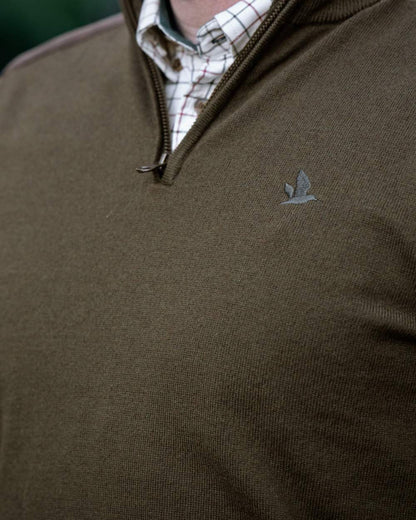 Light Pine coloured Seeland Mens Pine Half Zip Sweater on forest background 